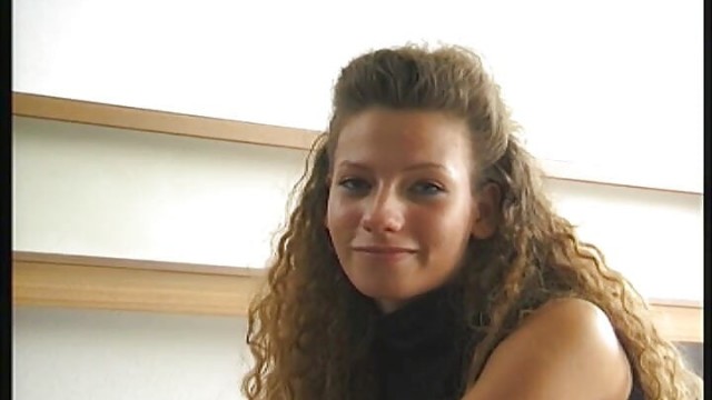 cute girl lolls on the bed and shows her willing cunt